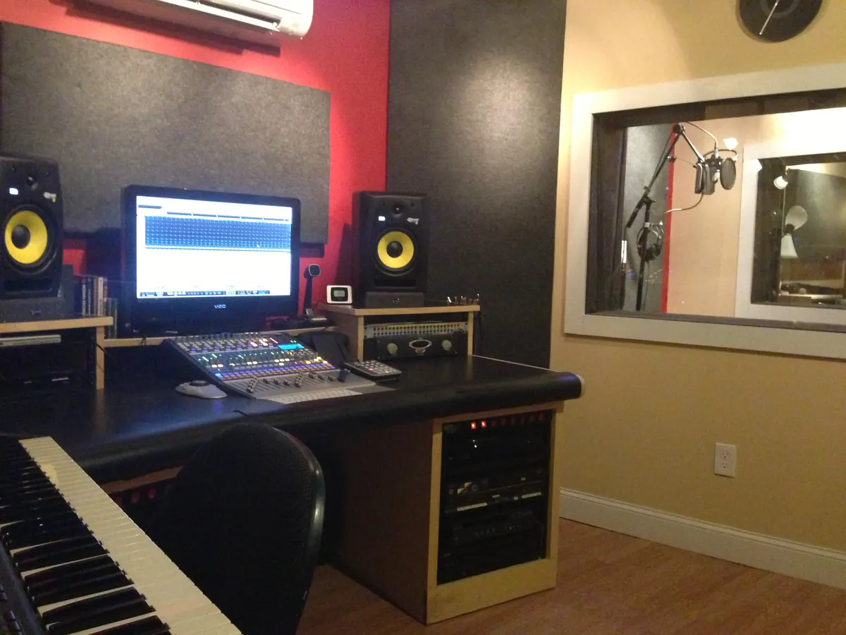 Installed studio desk with speakers and display