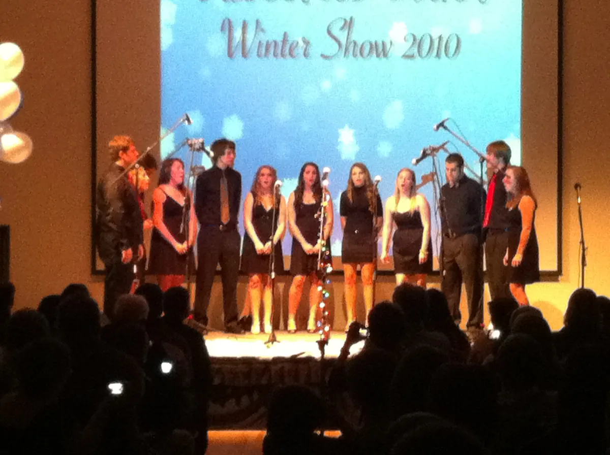Students performing a winter show on stage